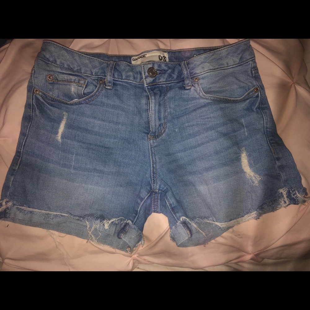 Distressed denim shorts.